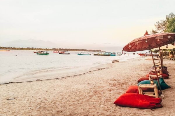 Gili Islands party scene with beach bars, lively crowds, and colorful lights