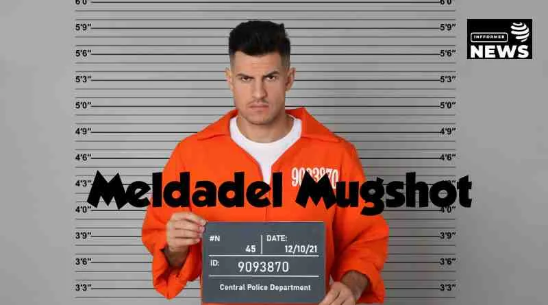 Meldadel mugshot depicting the individual post-arrest in a police station.