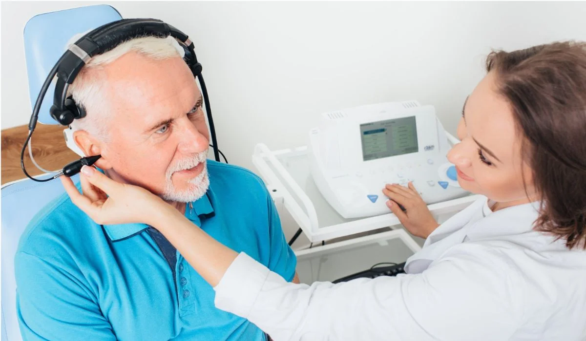 A person with Eustachian tube dysfunction comfortably watching a movie in a theater.