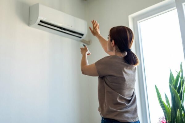 A sleek, modern air conditioner installed in a condominium, designed for energy efficiency and quiet operation.