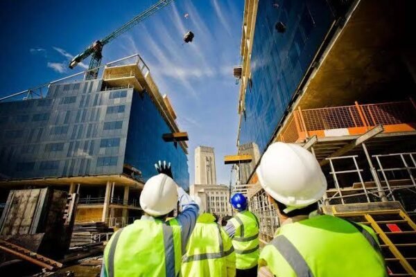 A group of engineers and researchers working on a construction project, representing Stichting Bouwresearch's contributions.